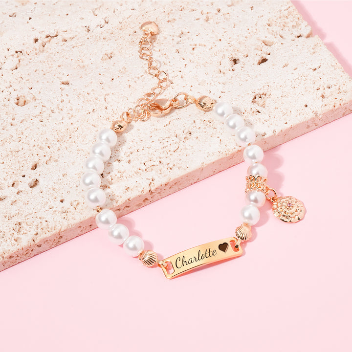 Personalized hand-woven baby name pearl bracelet with birthday flower